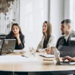 Group of people working out business plan in an office