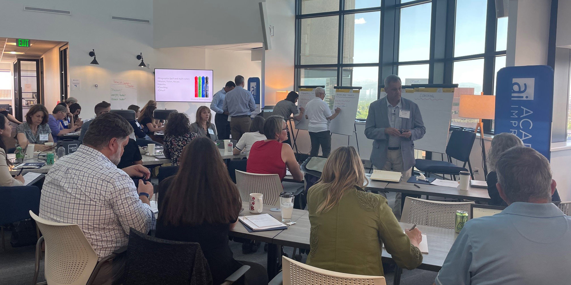 People doing an activity at an Academic Impressions conference